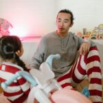 Father and daughter spend time together on the floor at home